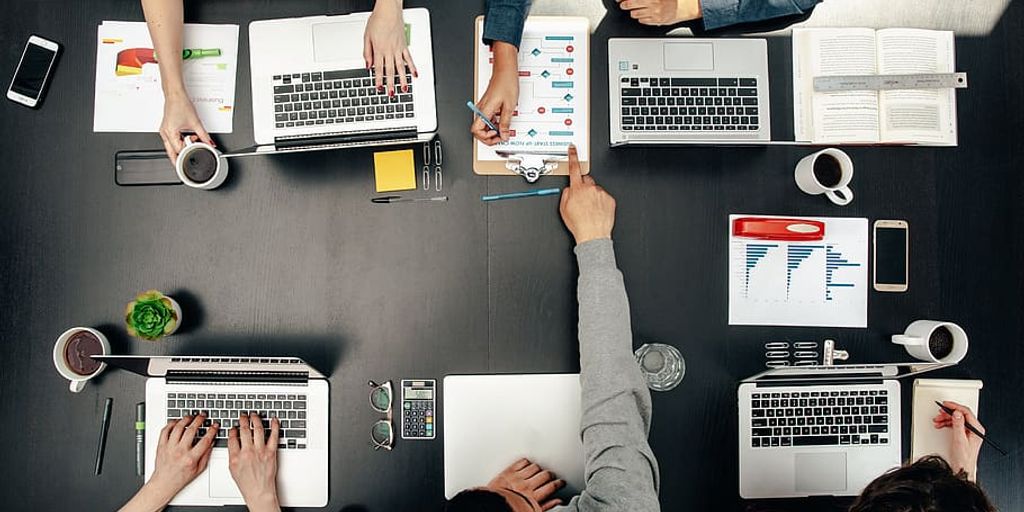 entrepreneur presenting startup idea to investors in modern office