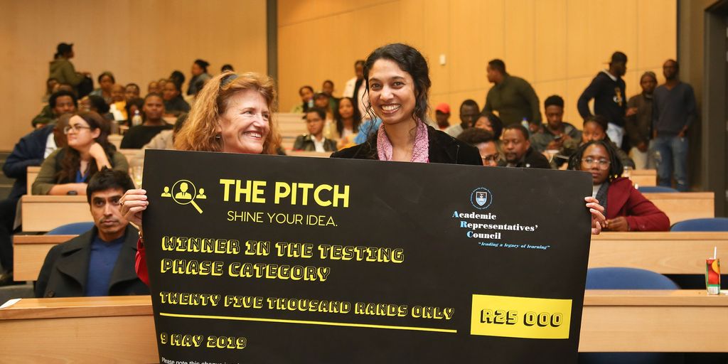 entrepreneur pitching to investors in a modern office