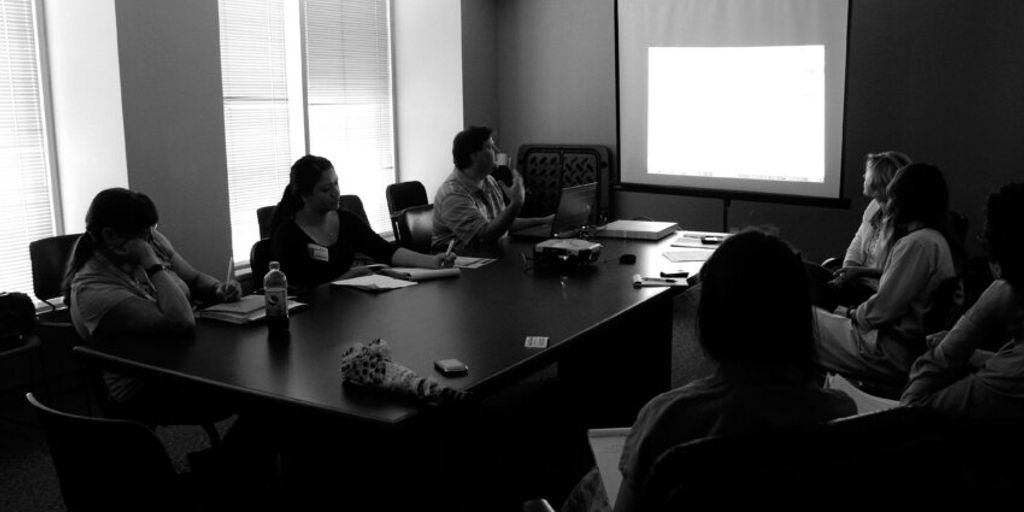 business leaders discussing strategy in a modern office