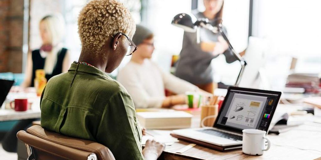 entrepreneurs discussing funding in a modern office